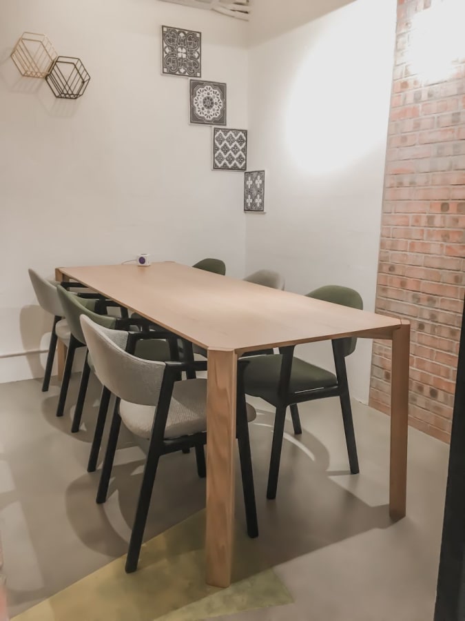 Sleek coworking space in Wan Chai with modern decor and ample seating for collaboration.