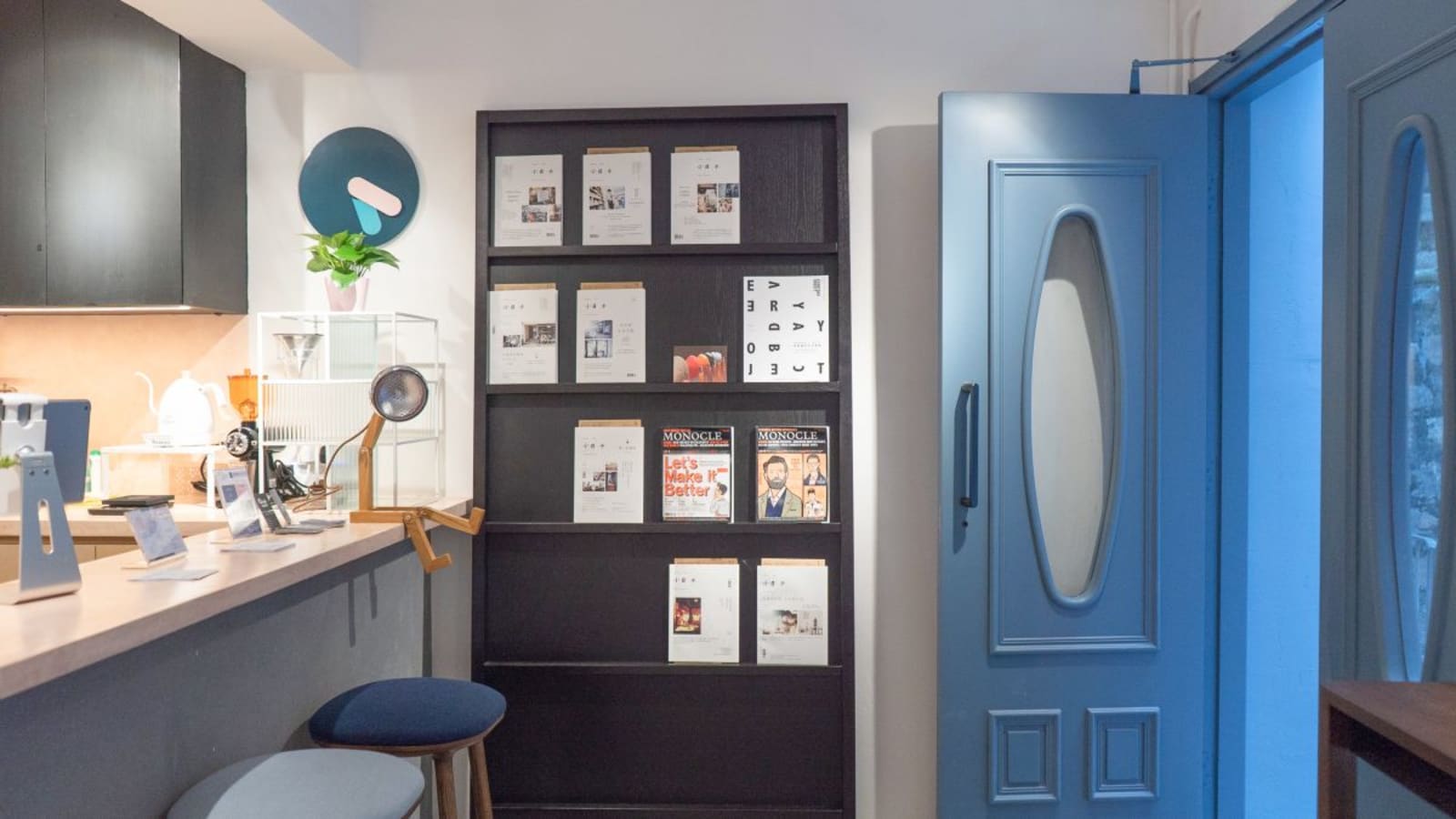 Chic coworking space with magazine rack and cozy seating in vibrant Wan Chai location.