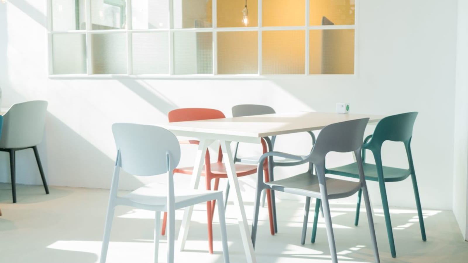 Bright coworking space with modern chairs and ample natural light on How Ming Street.