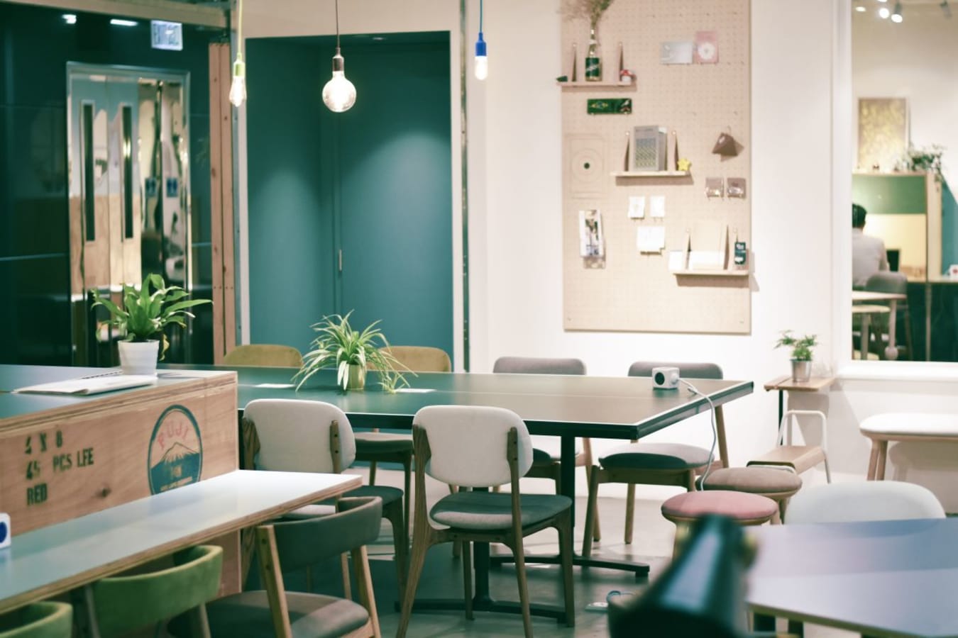Stylish coworking space with modern decor, ample seating, and creative ambiance.