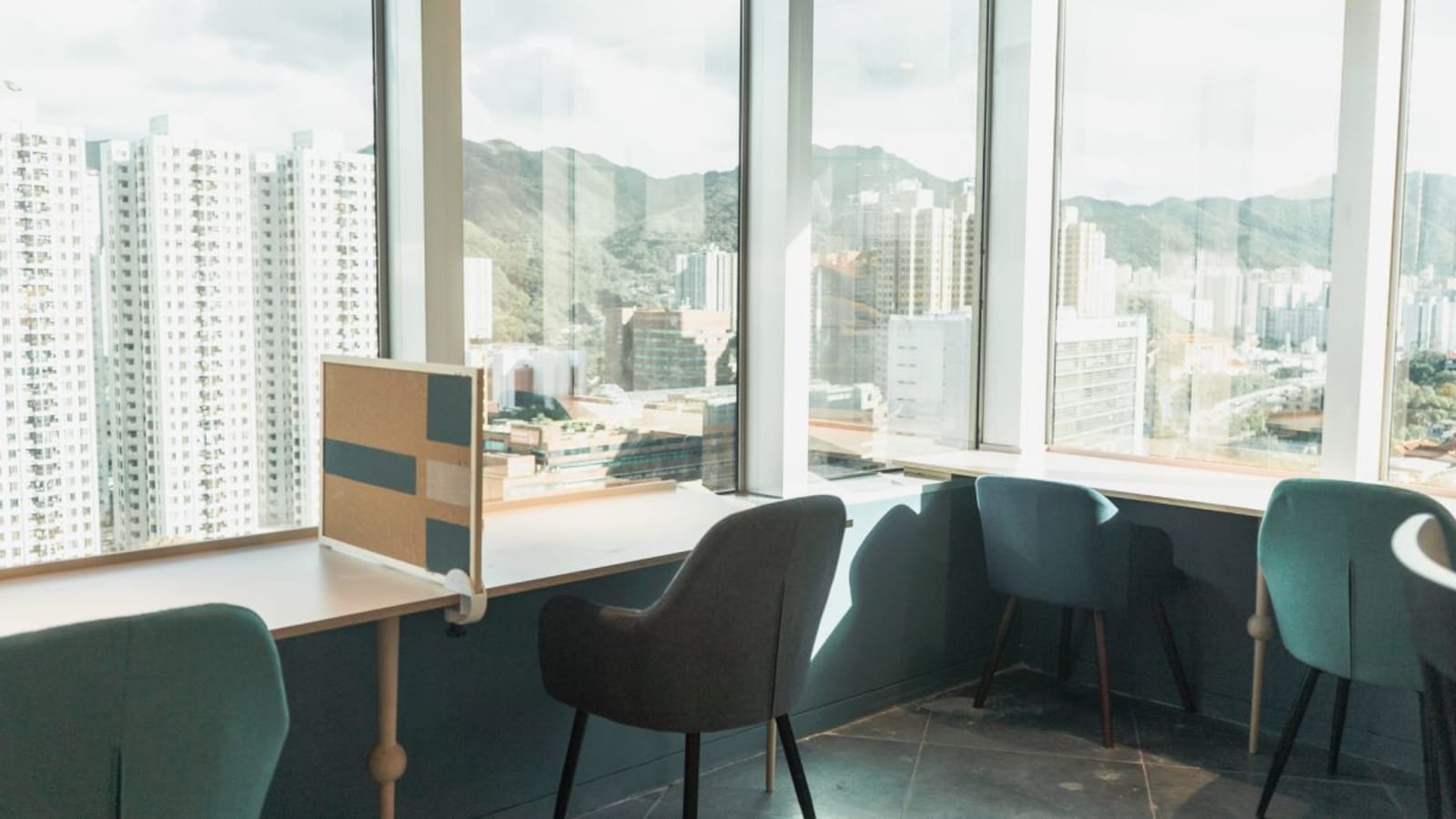 Bright coworking space with mountain views and modern furnishings on Sha Tin Rural Committee Road.