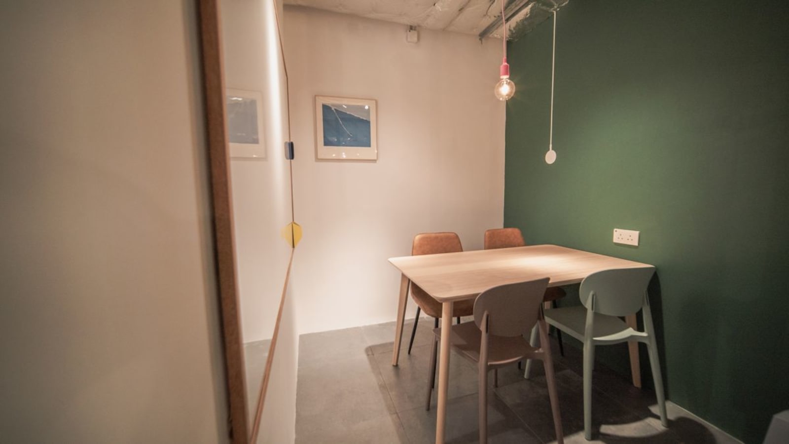 Cozy meeting nook with modern decor and creative lighting in Sha Tin coworking space.