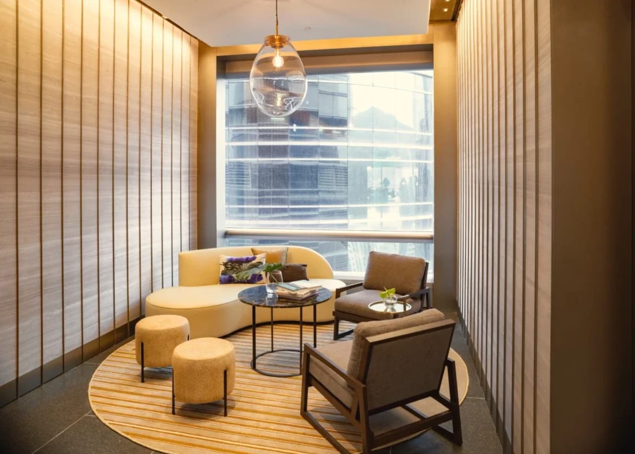 Chic coworking nook with comfy seating and natural light, perfect for focus and collaboration.