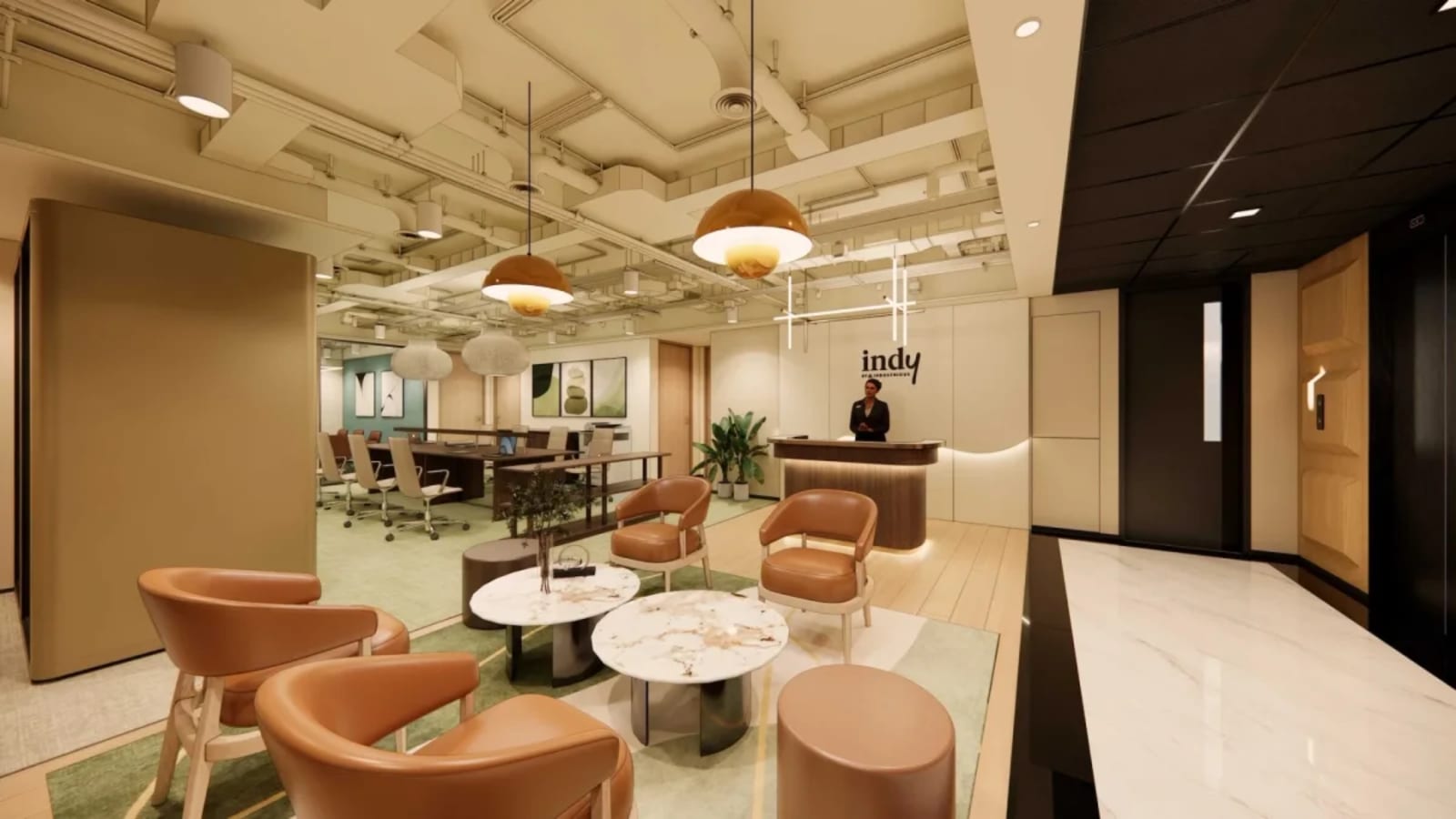 Modern coworking space with stylish seating, warm lighting, and a welcoming reception area.