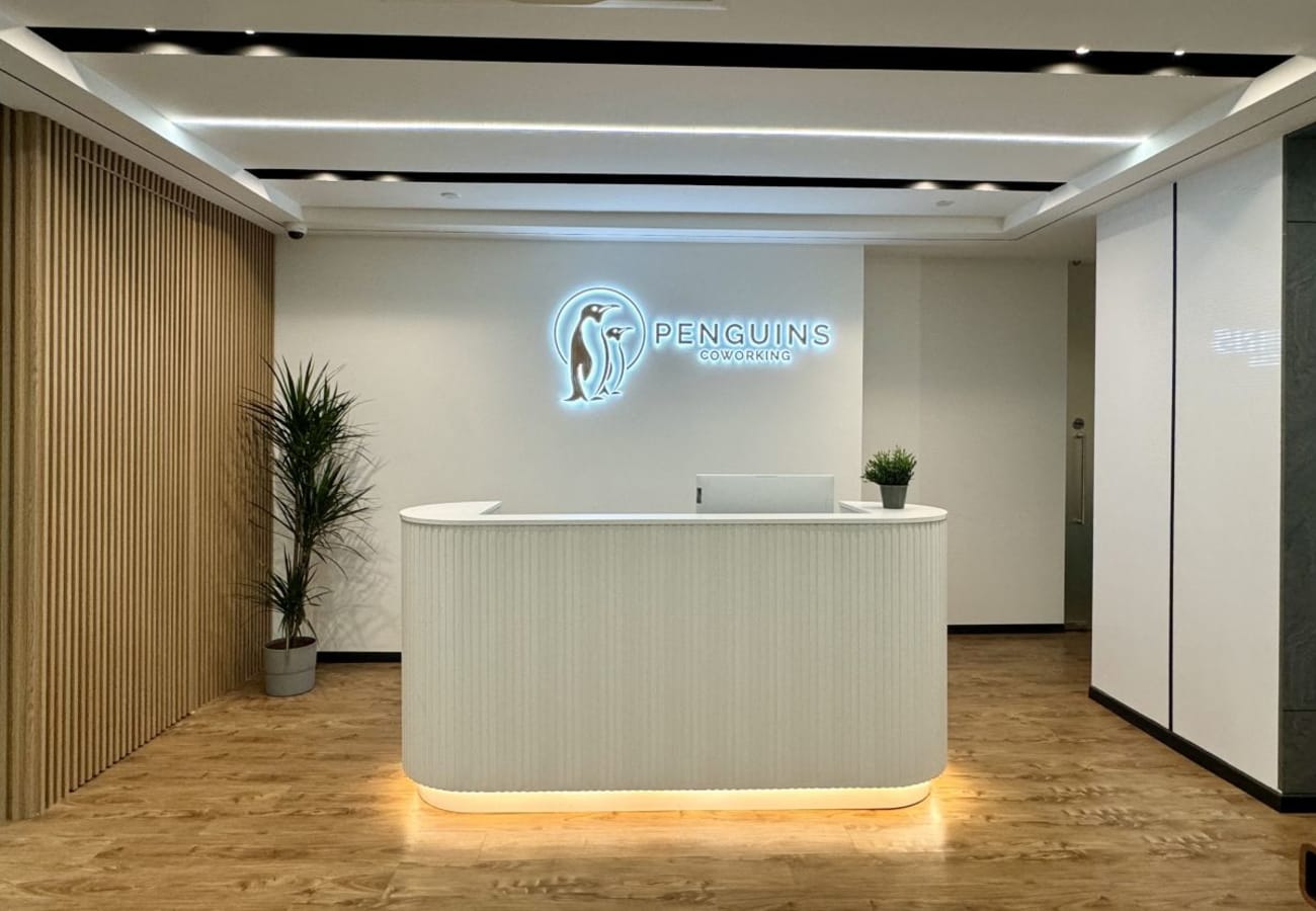 Sleek reception area in Anson Road coworking space with modern design and warm lighting.