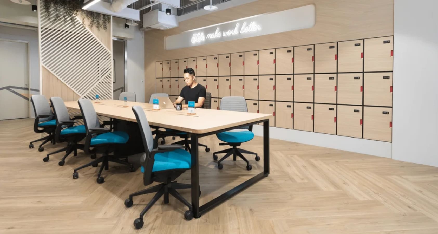 Modern coworking space with ample seating, natural light, and secure lockers. Ideal for productivity.