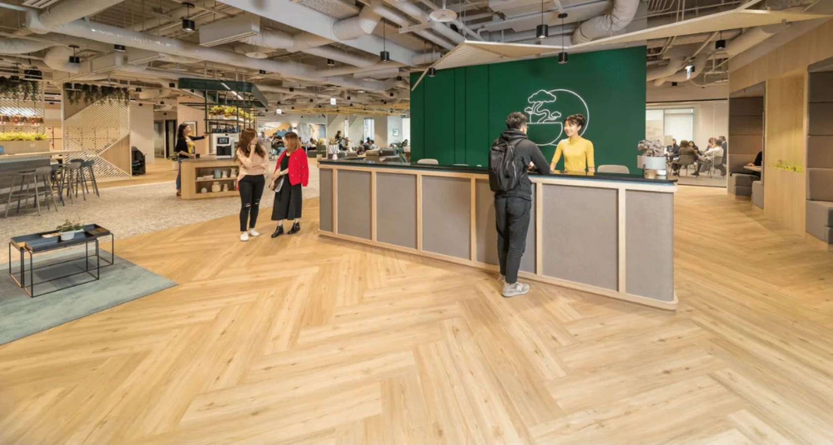 Spacious coworking hub with modern design and bright, welcoming reception area.