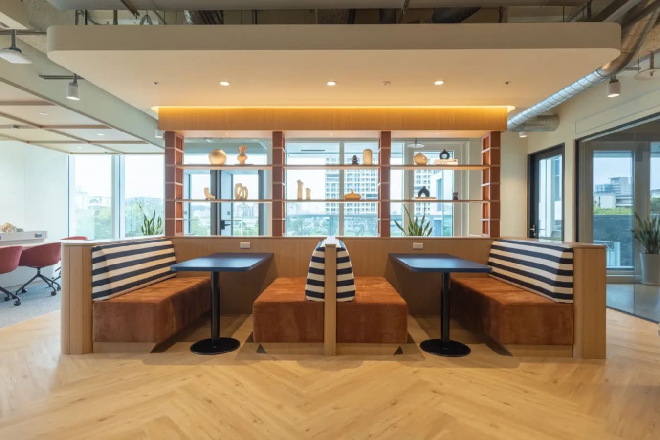 Stylish seating with natural light and modern decor in Taipei's flexible coworking space.