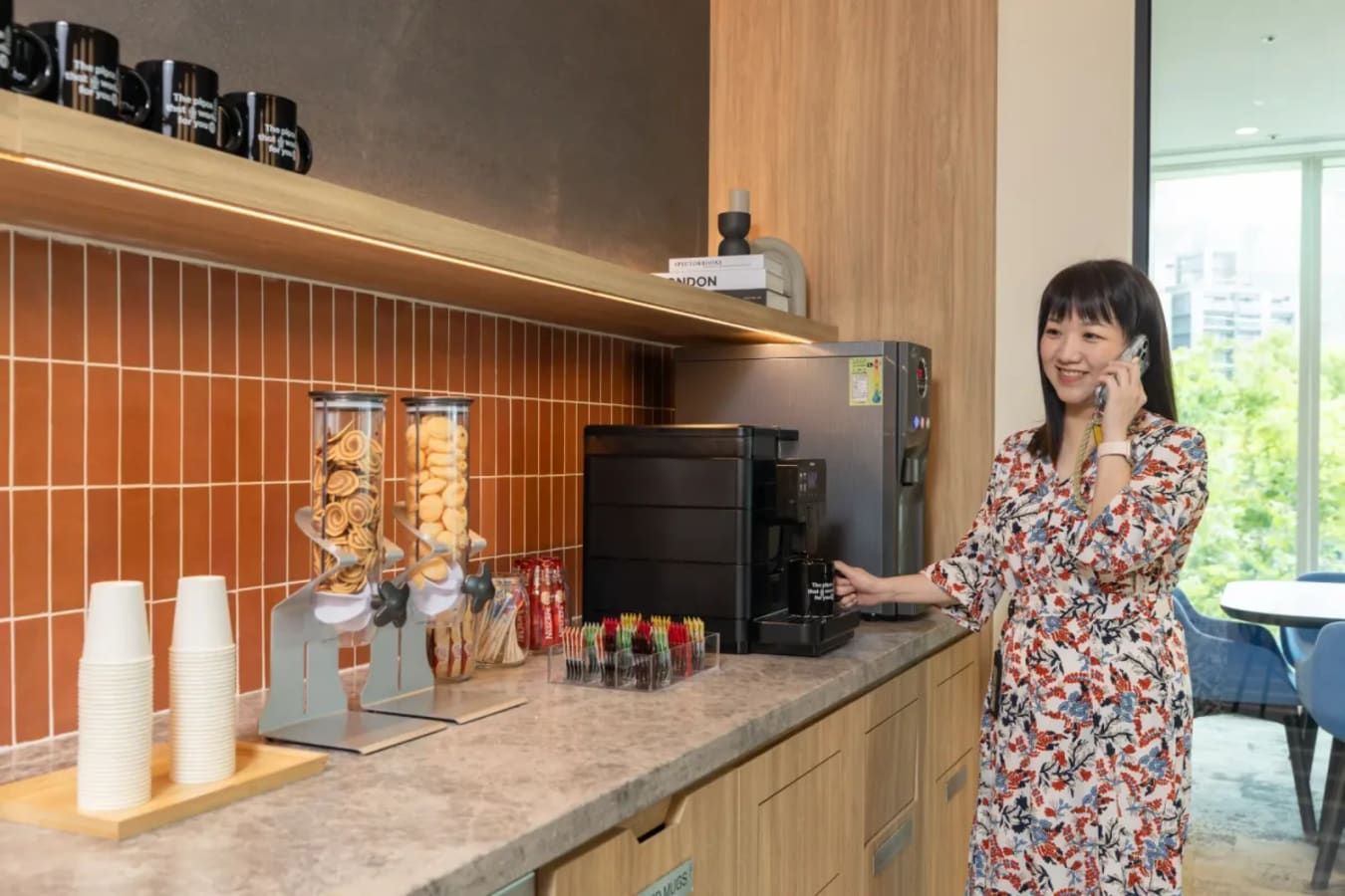 Modern coworking kitchen with coffee station and snacks in Taipei. Ideal for professionals on the go.