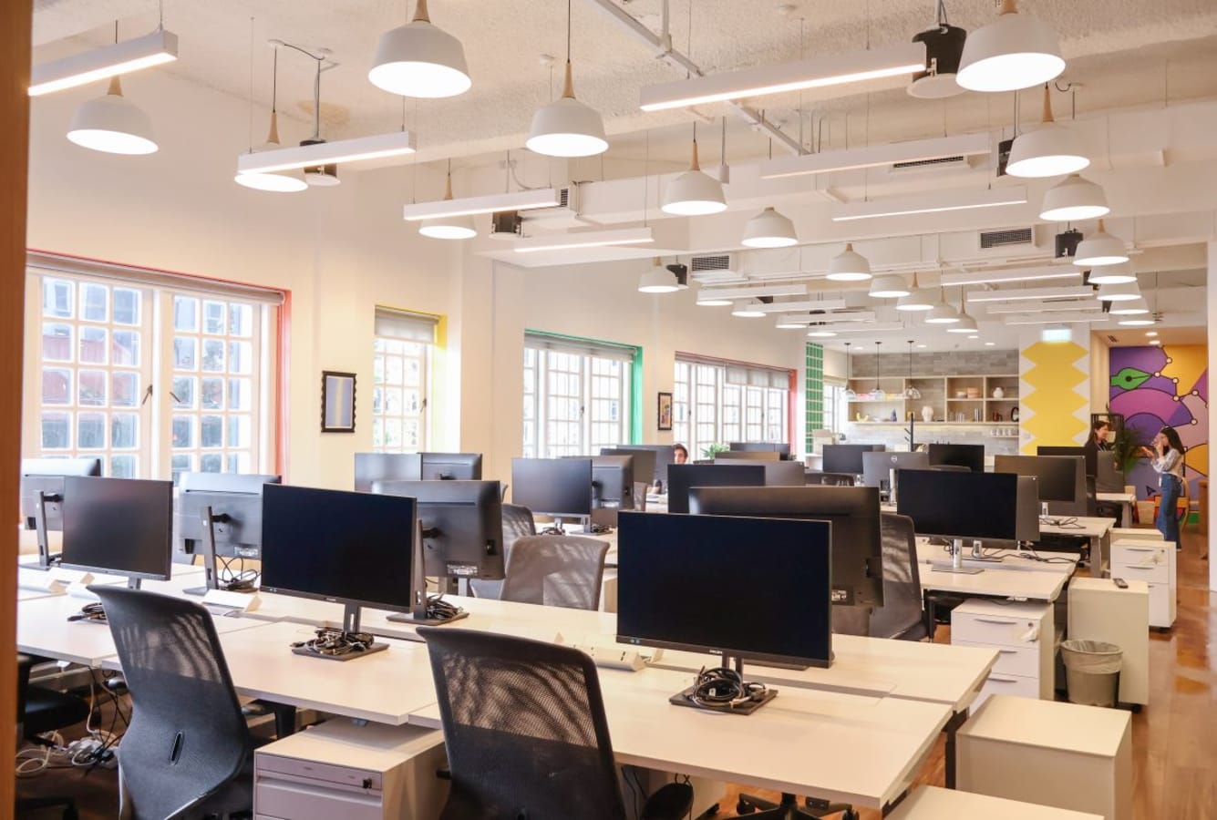 Bright, modern coworking space with ample seating and natural light on Neil Road, Singapore.