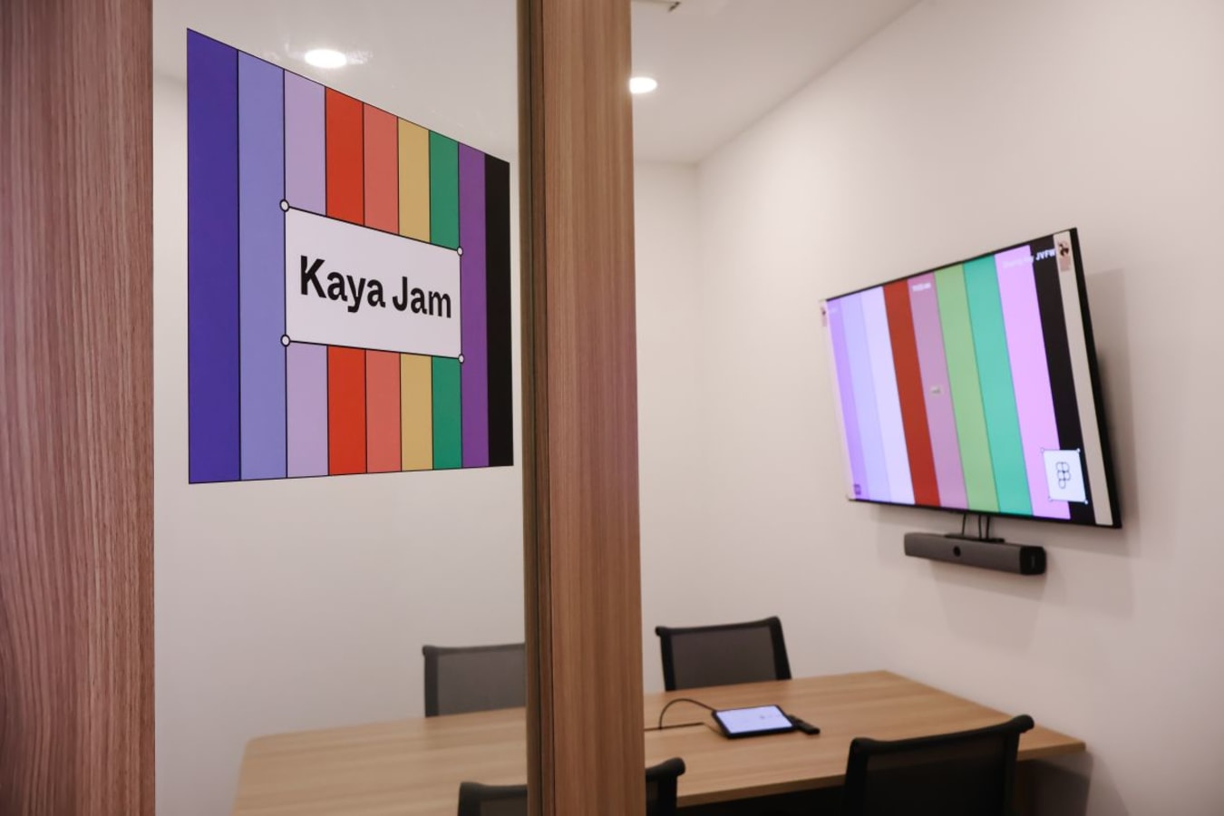 Contemporary meeting room in a Neil Road coworking space, equipped with modern AV facilities.