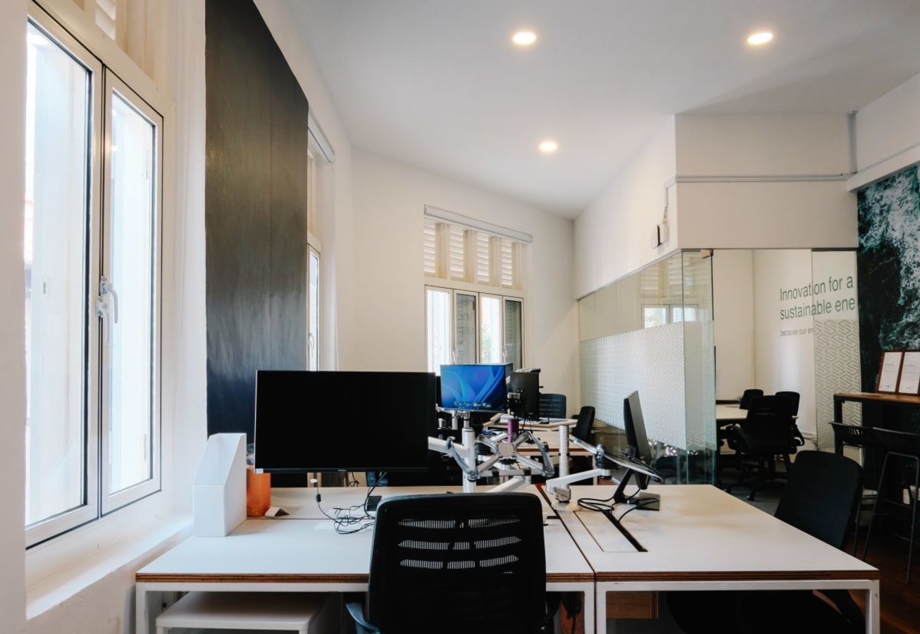 Bright, flexible workspace with modern desks and ample natural light on Club Street, Singapore.