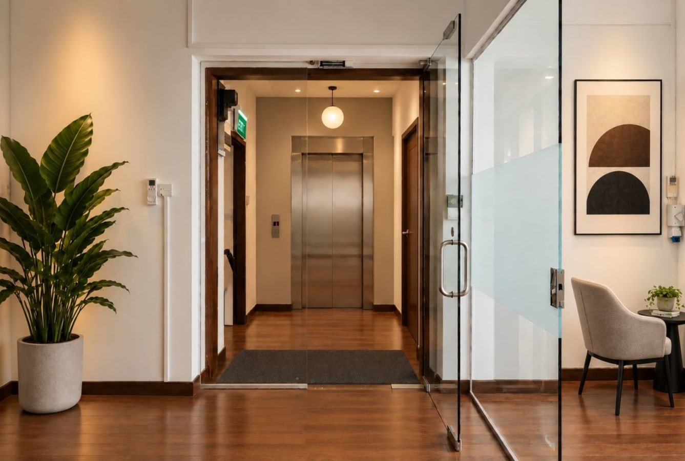Bright coworking space with modern decor and elevator access on Telok Ayer Street.