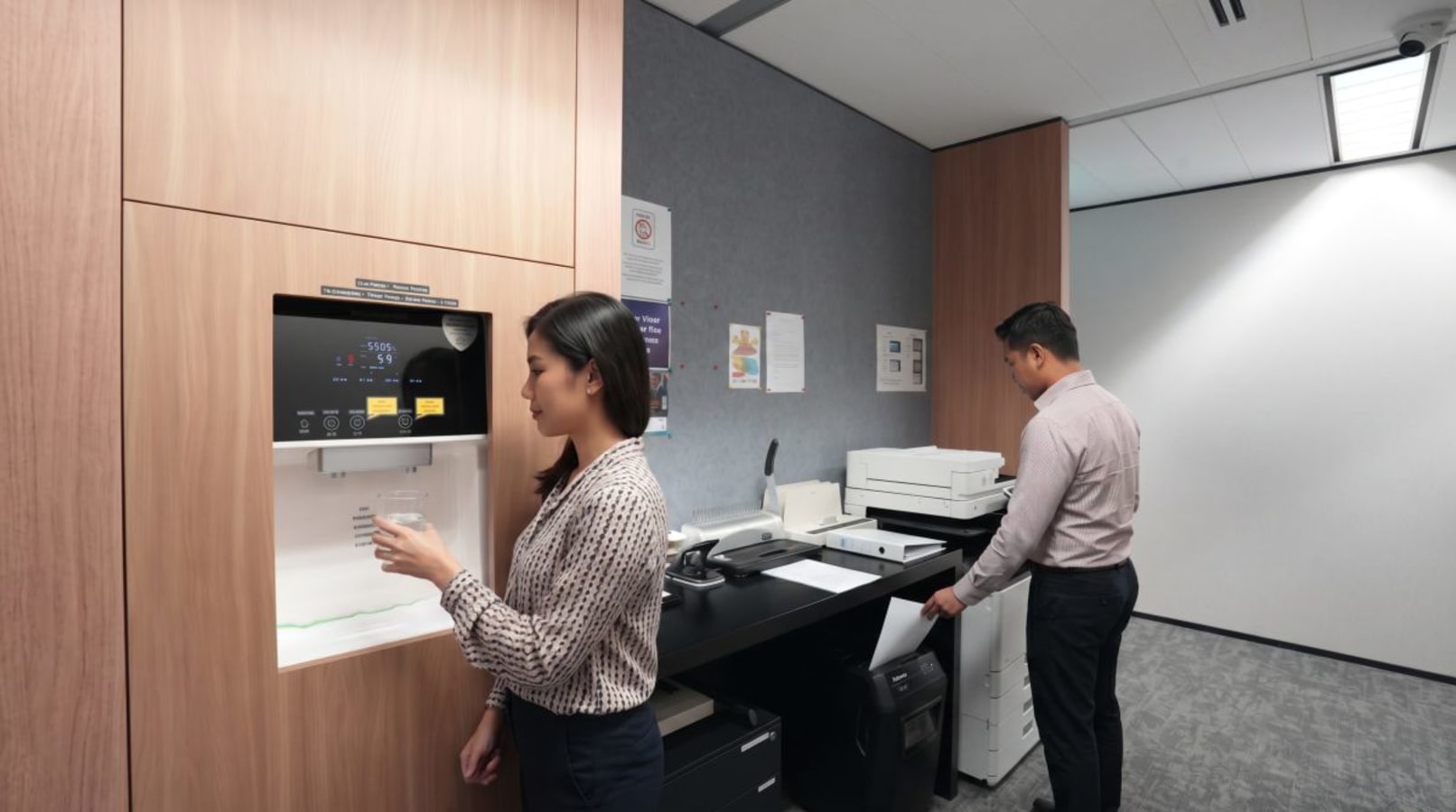 Modern coworking space with state-of-the-art printing station and sleek design features.