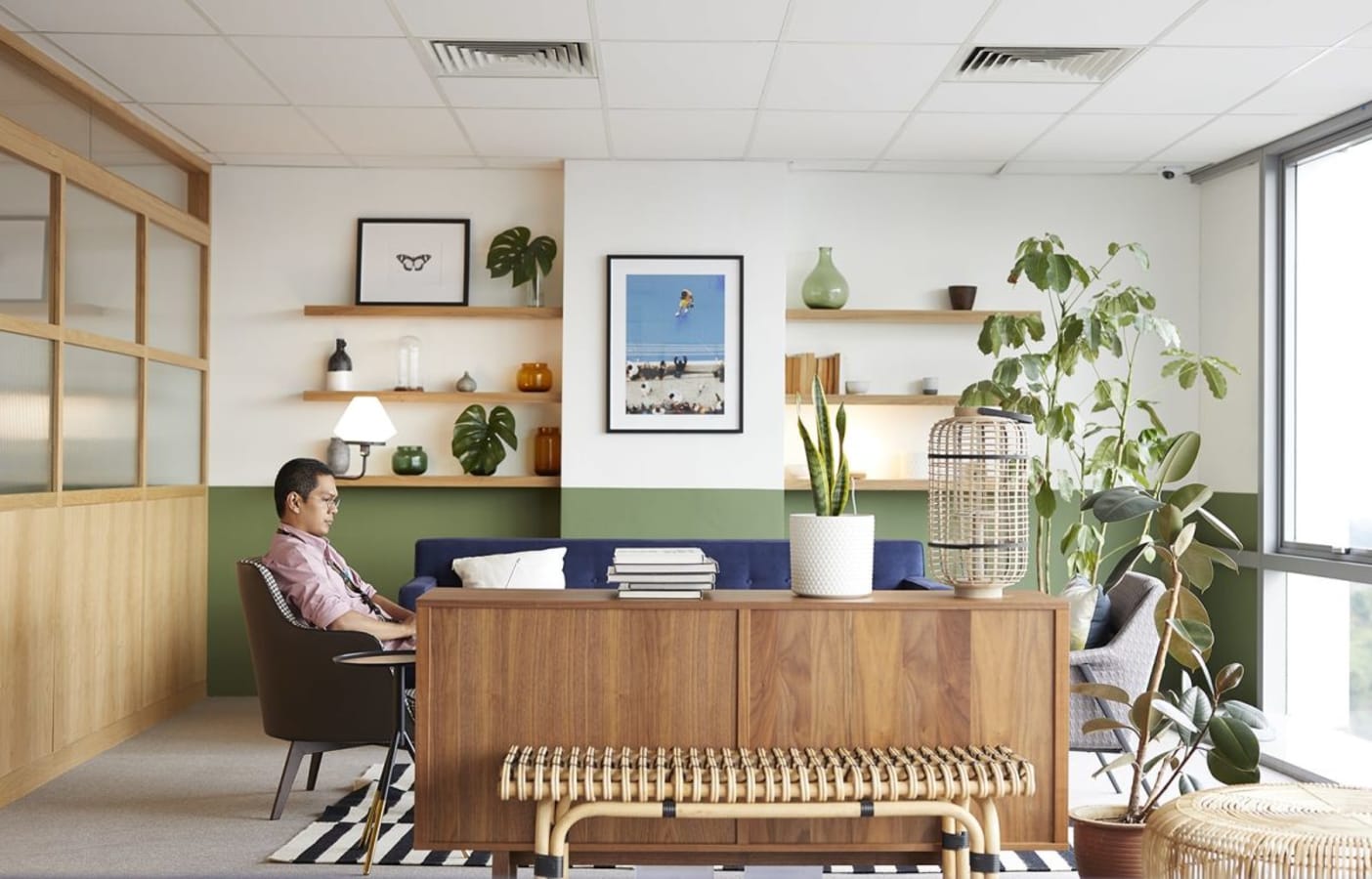 Stylish coworking space with natural light, cozy seating, and modern decor. Perfect for collaboration.