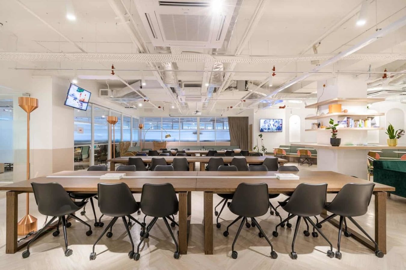 Modern coworking space with ample seating, natural light, and stylish decor in Jalan Kiara.