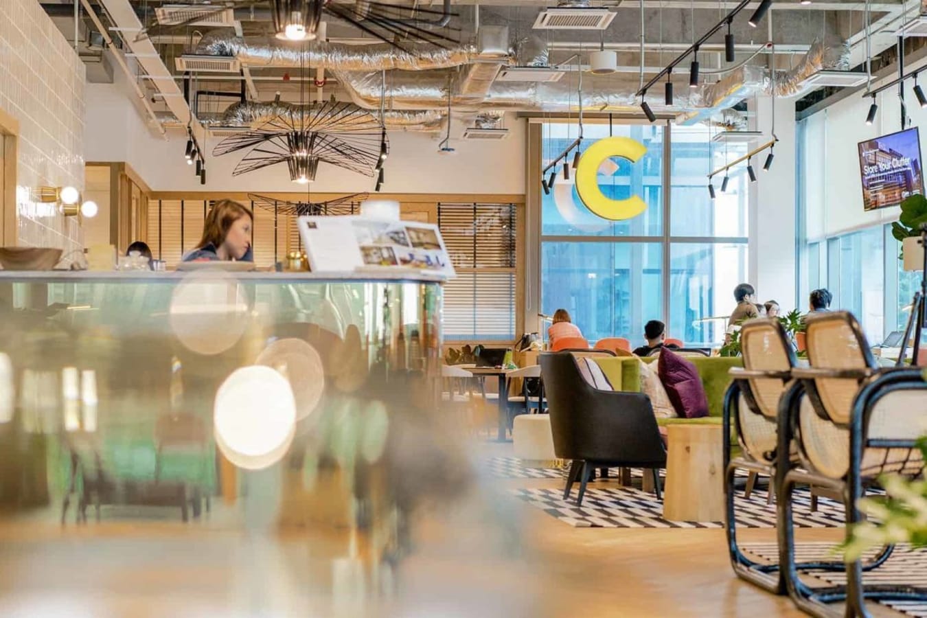 Vibrant coworking area with modern decor and ample natural light in Jalan Bangsar, Kuala Lumpur.