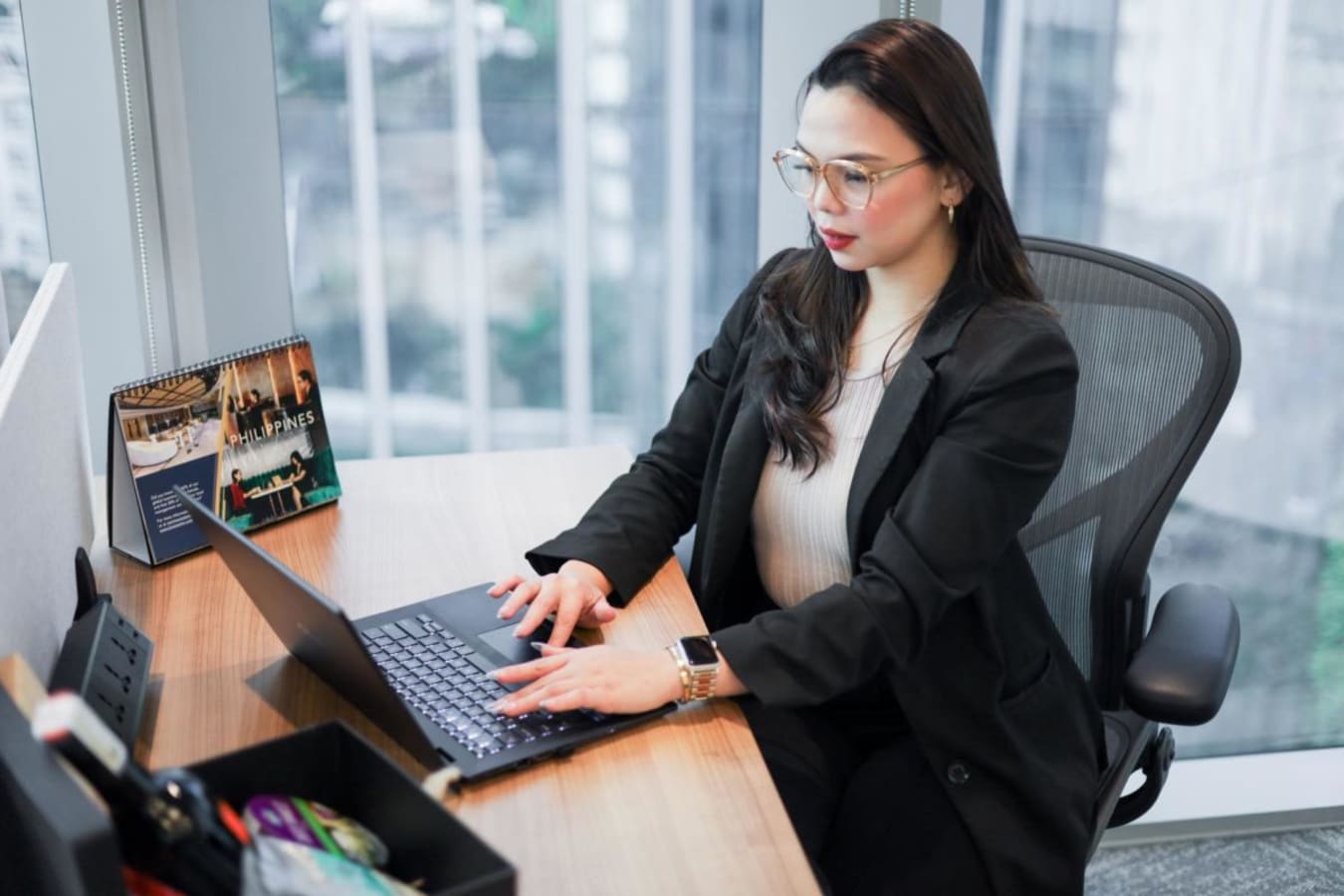 Modern Makati coworking space with ergonomic chair, large window views, and a productive vibe.