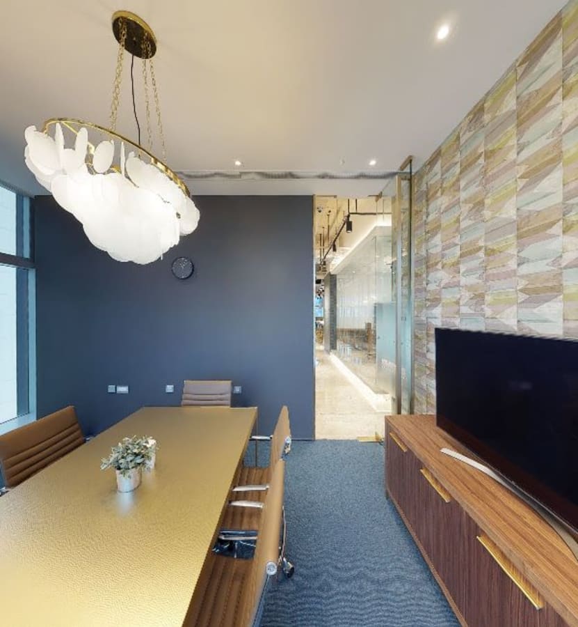 Stylish meeting room with modern lighting and sleek furnishings in Kowloon Bay coworking space.