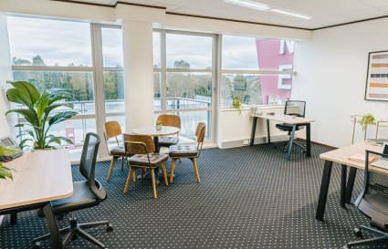 External 7-person workspace with access to coworking breakout areas