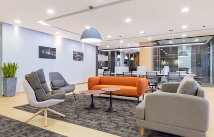 Bright, modern coworking space with stylish seating and ample natural light in Marina Boulevard.
