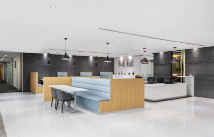 Modern coworking space with sleek design, ample lighting, and comfortable seating on Fullerton Rd.