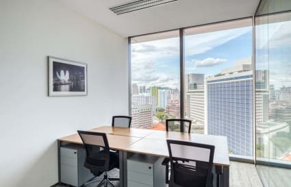 Bright workspace with city views, modern desks, and ergonomic chairs on Wallich Street, Singapore.