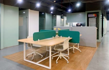 Modern coworking space with comfortable seating and bright lighting on Filinvest Avenue.