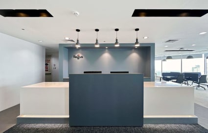 Sleek, modern reception area featuring minimalist design and ample natural lighting. Ideal for professionals.