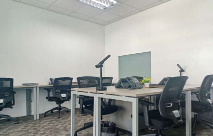 Modern coworking space in Estrella, Manila, featuring ergonomic chairs and ample desks.