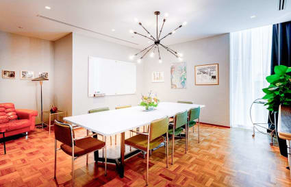 Modern coworking space with stylish seating, ample lighting, and a collaborative environment.