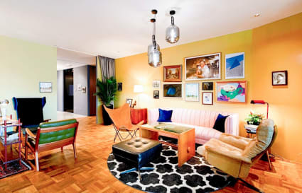 Stylish coworking space with eclectic décor, comfortable seating, and vibrant artwork.