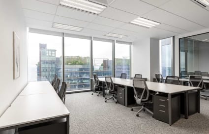 Modern coworking space with natural light and city views in Marina View, Singapore.
