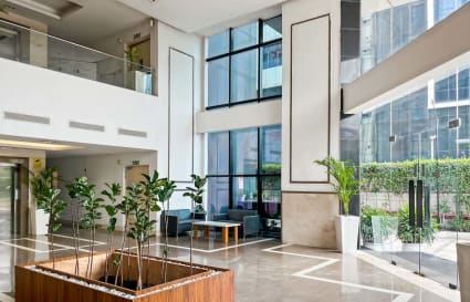 Bright and inviting coworking space with modern decor and ample natural light.