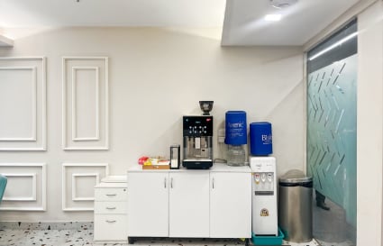 Modern coworking space with convenient coffee and water station on Noida-Greater Noida Expressway.