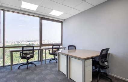 Bright, airy coworking space with modern desks and city views on JNTU Road.