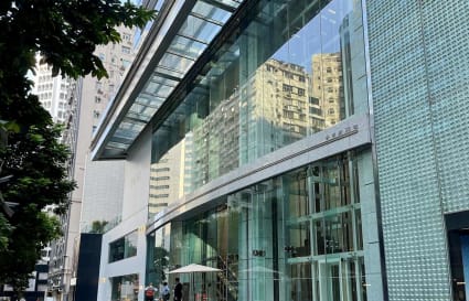 Modern coworking space on Hysan Avenue, featuring sleek glass exteriors and urban views.