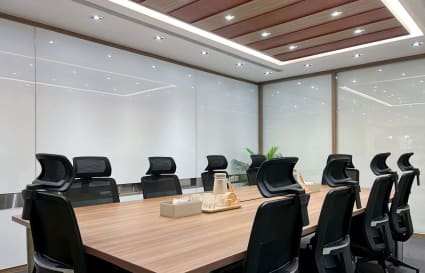 Modern coworking space with sleek seating and a spacious meeting table on Hysan Avenue.