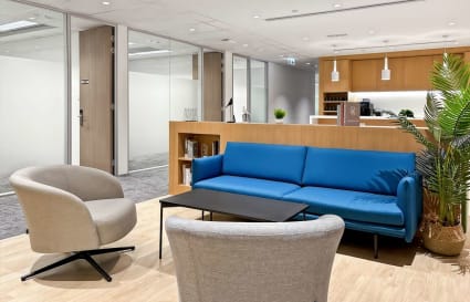 Modern coworking space with a cozy seating area and natural light on Observatory Road.