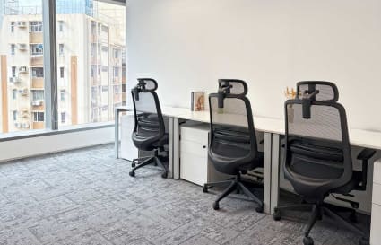 Bright coworking space with ergonomic chairs and ample natural light on Observatory Road.