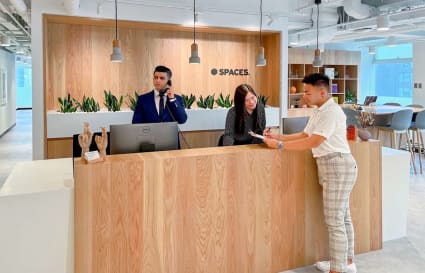 Welcoming reception area with modern design and natural wood accents. Ideal for coworking.