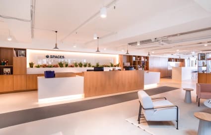 Modern coworking space with sleek design and ample seating on Wai Yip Street.