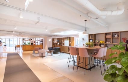 Modern coworking space with open layout and stylish seating on Wai Yip Street.