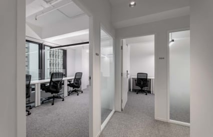 Modern coworking space with ample natural light and private offices on 德輔道中.