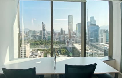 Modern office with stunning city views, natural light, and flexible seating on Canton Road.