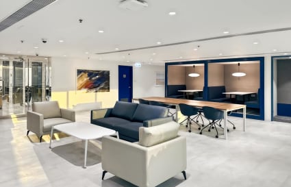 Modern coworking space with sleek seating, collaborative desks, and ample lighting on Nathan Road.