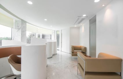 Modern coworking space with sleek design, natural light, and comfortable seating in Maharashtra.