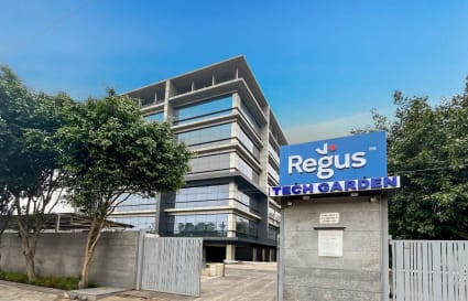 Modern coworking space in a sleek, glass-fronted building offering flexible office solutions.