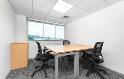 Bright, modern coworking space with ergonomic seating and natural light. Ideal for productivity.