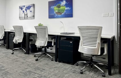 Modern coworking space in Gurugram with ergonomic chairs and ample desk space.